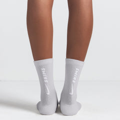 NikeSKIMS ACCESSORIES DRI-FIT™ CREW SOCK 3-PACK | HEATHER GREY MULTI & LAYS FLAT ON A WHITE BACKGROUND | FLT