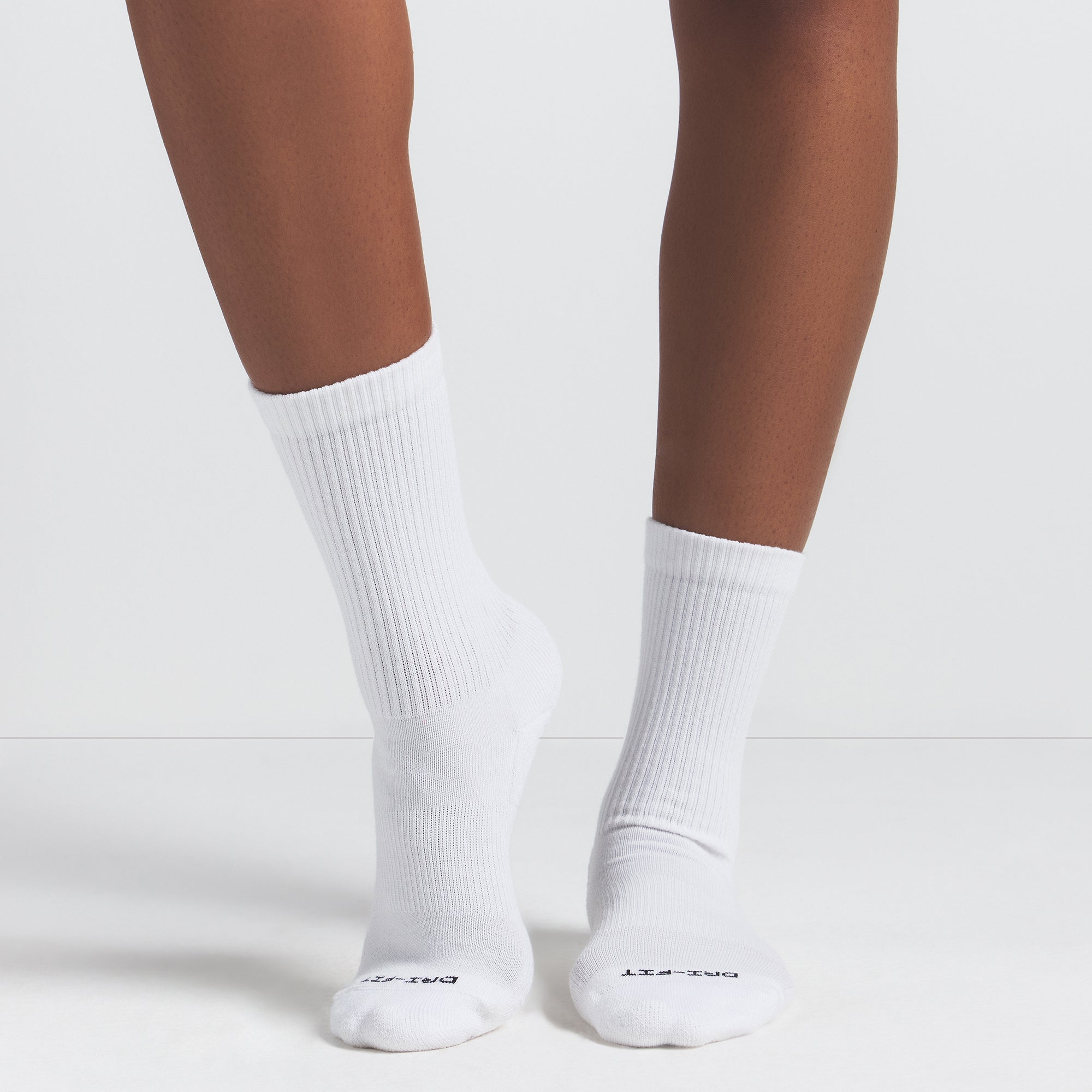 NikeSKIMS ACCESSORIES DRI-FIT™ CREW SOCK 3-PACK | HEATHER GREY MULTI & LAYS FLAT ON A WHITE BACKGROUND | FLT