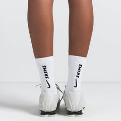 NikeSKIMS DRI-FIT CREW SOCK 3-PACK | SNOW ON A MODEL FRONT VIEW @ | FOCUS: 0.0, 1.0, 0.9