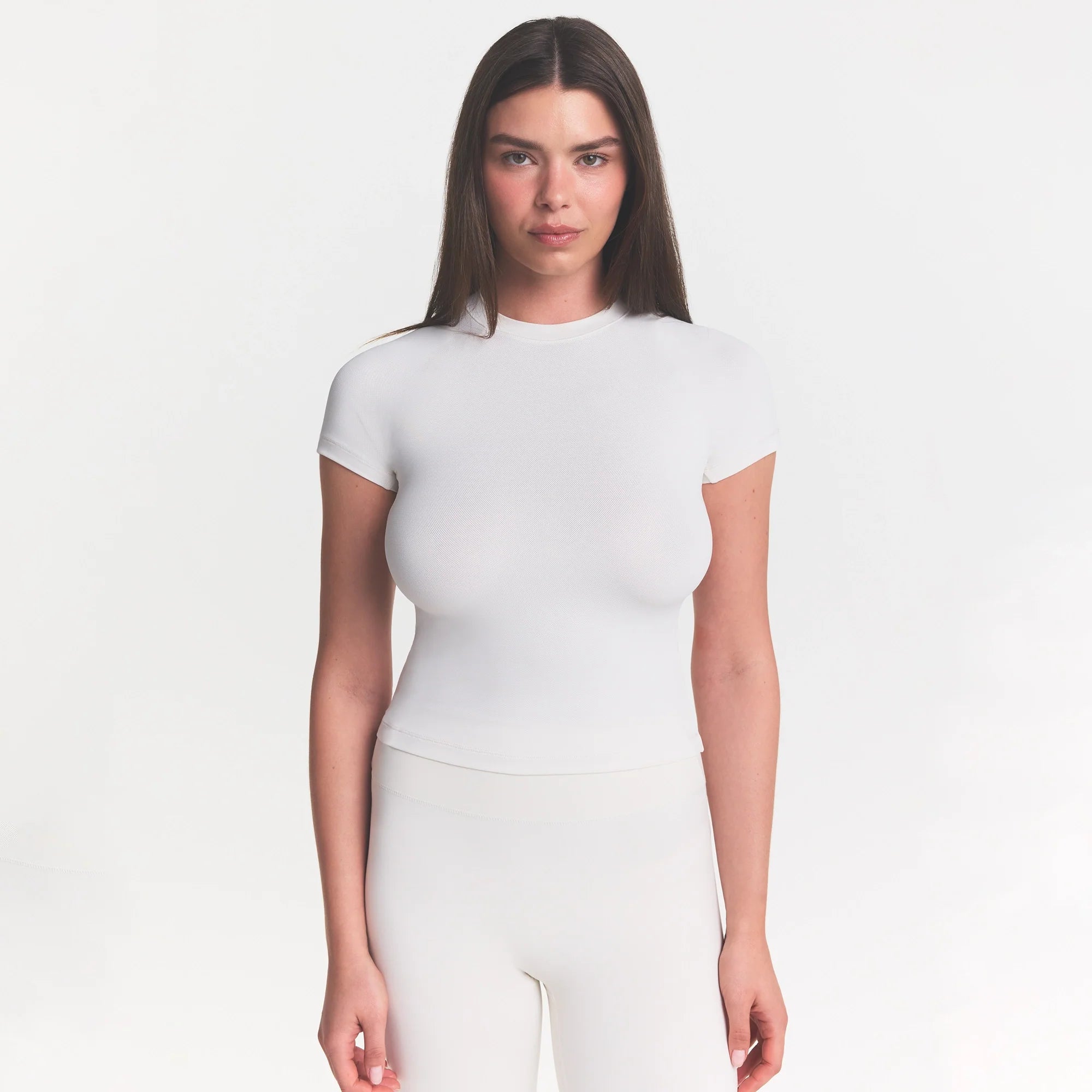 NikeSKIMS MATTE PADDED BABY TEE | IVORY ON A MODEL 