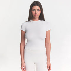NikeSKIMS MATTE PADDED BABY TEE | IVORY ON A MODEL 