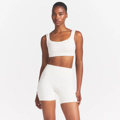 NikeSKIMS MATTE 5" BIKER SHORT | IVORY ON A MODEL 