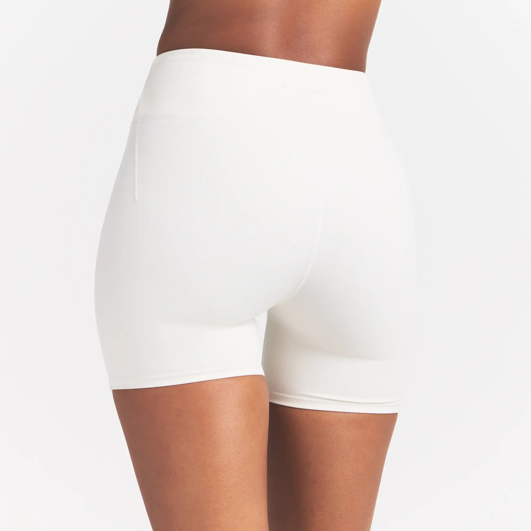 NikeSKIMS MATTE 5" BIKER SHORT | IVORY ON A MODEL 