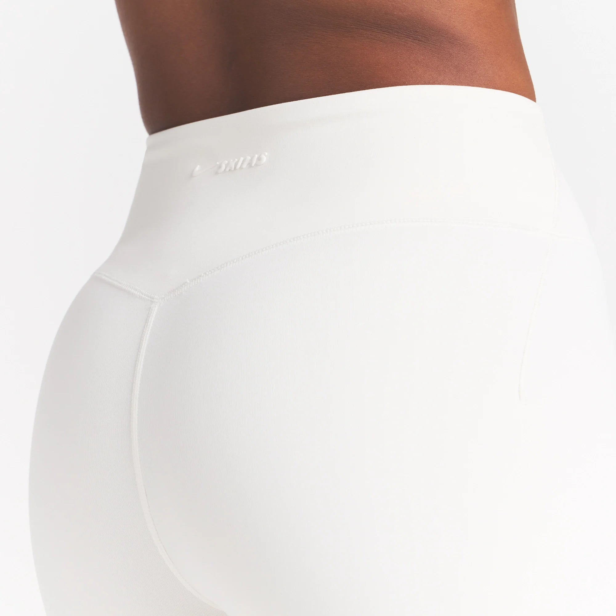 NikeSKIMS MATTE 5" BIKER SHORT | IVORY ON A MODEL 