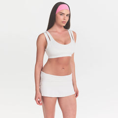 NikeSKIMS MATTE DOUBLE STRAP SCOOP BRA | IVORY ON A MODEL 