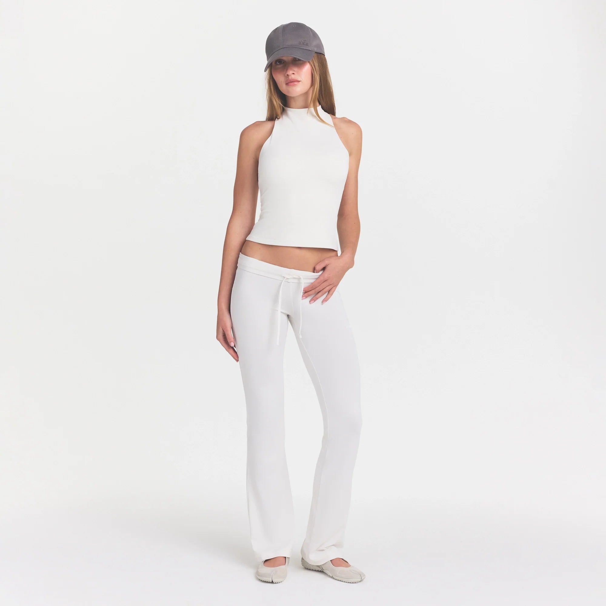 NikeSKIMS MATTE MOCK NECK RACER TANK | IVORY ON A MODEL 