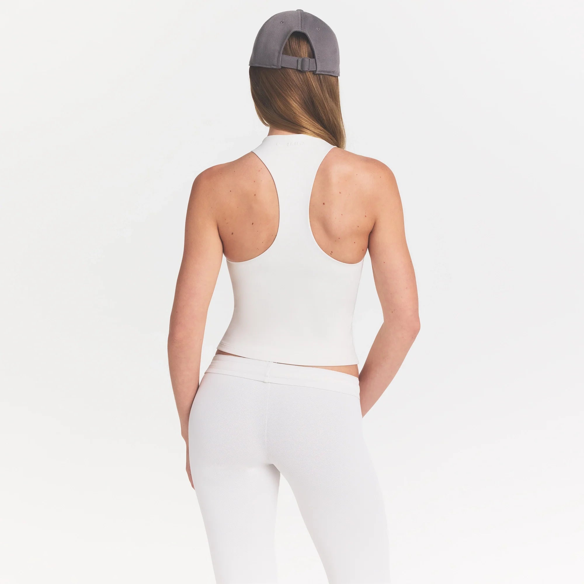 NikeSKIMS MATTE MOCK NECK RACER TANK | IVORY ON A MODEL 
