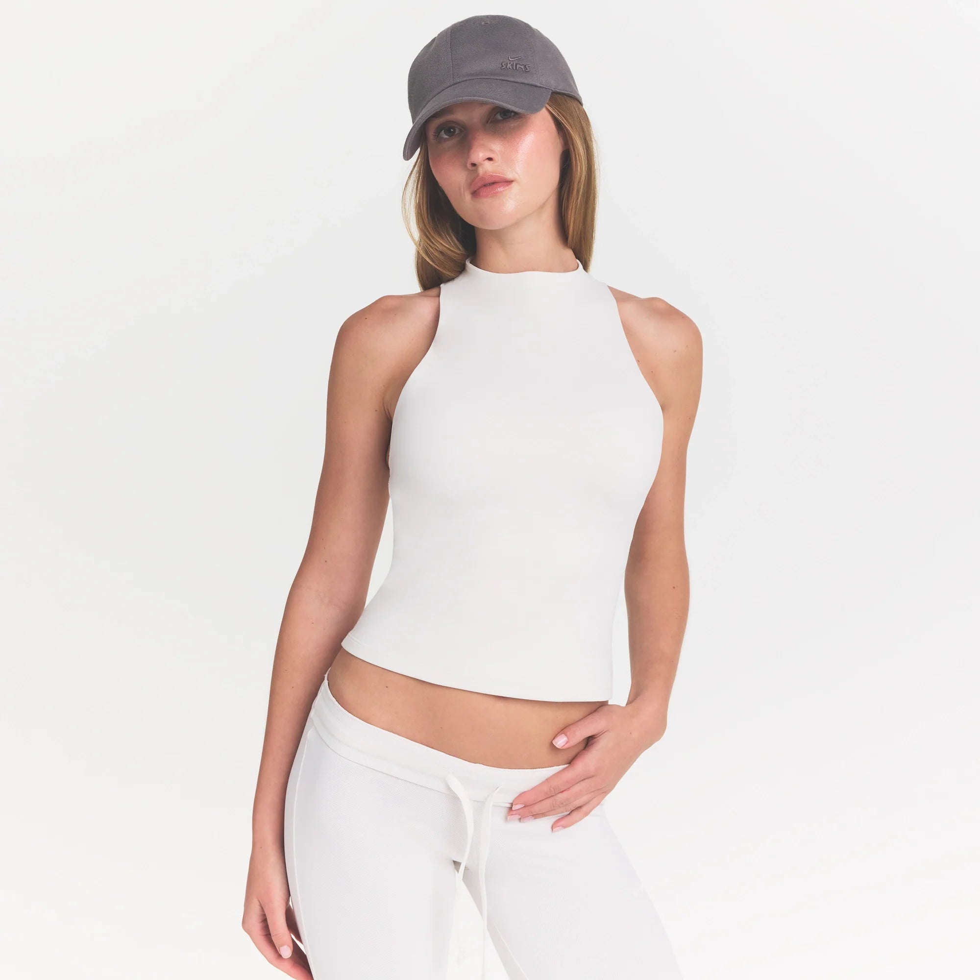 NikeSKIMS MATTE MOCK NECK RACER TANK | IVORY ON A MODEL 