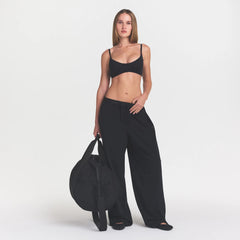 NikeSKIMS MATTE MICRO SCOOP BRA | OBSIDIAN ON A MODEL FRONT VIEW @ | FOCUS: 0.0, 1.0, 0.9