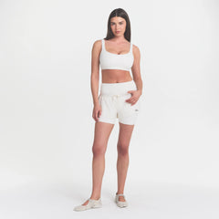 NikeSKIMS MATTE SCOOP NECK BRA | IVORY ON A MODEL 