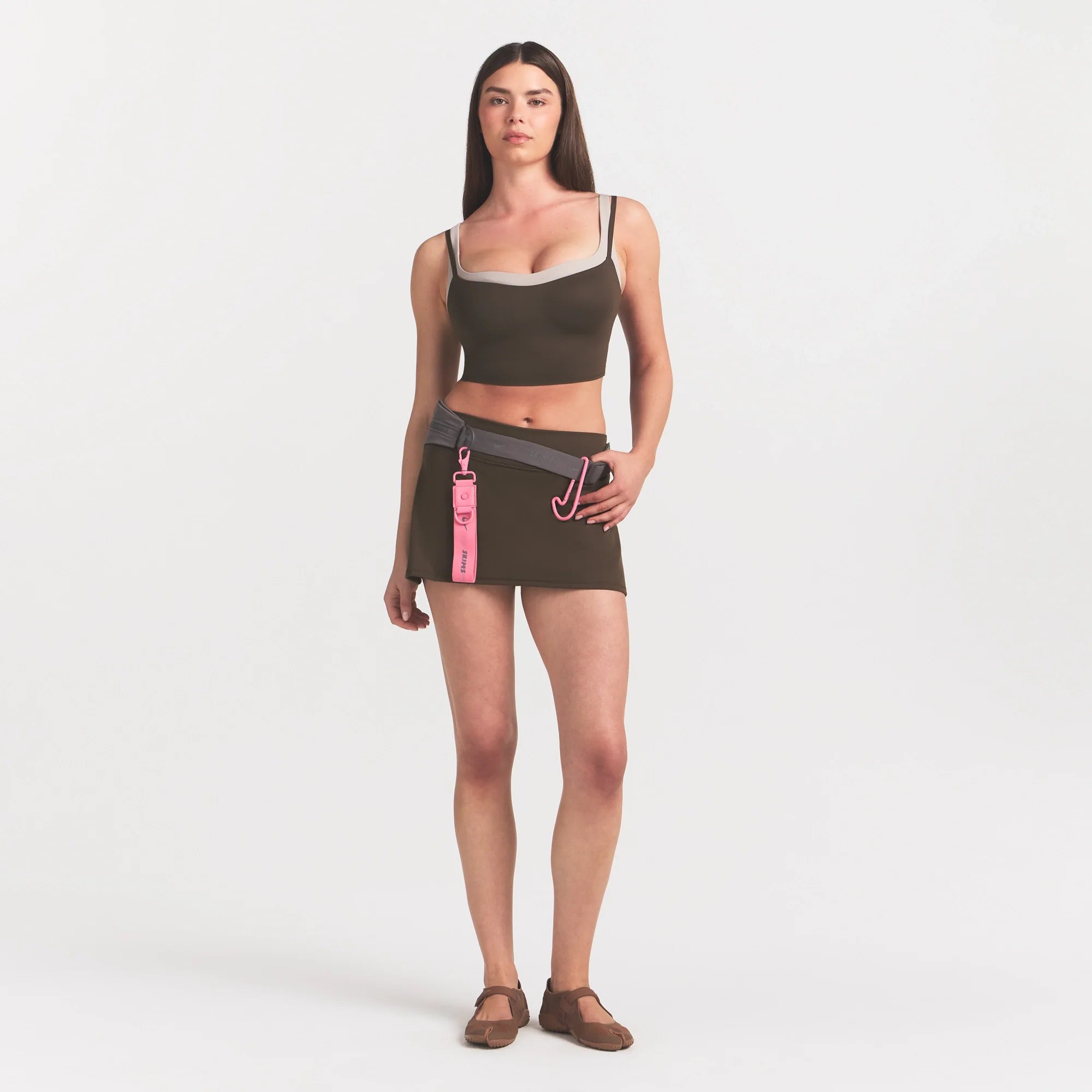 NikeSKIMS MATTE SKORT | NSKM DARK SEPIA ON A MODEL 