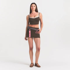 NikeSKIMS MATTE SKORT | NSKM DARK SEPIA ON A MODEL 