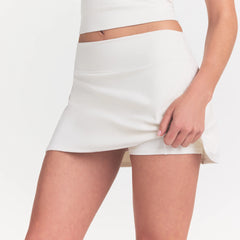 NikeSKIMS MATTE SKORT | IVORY ON A MODEL 