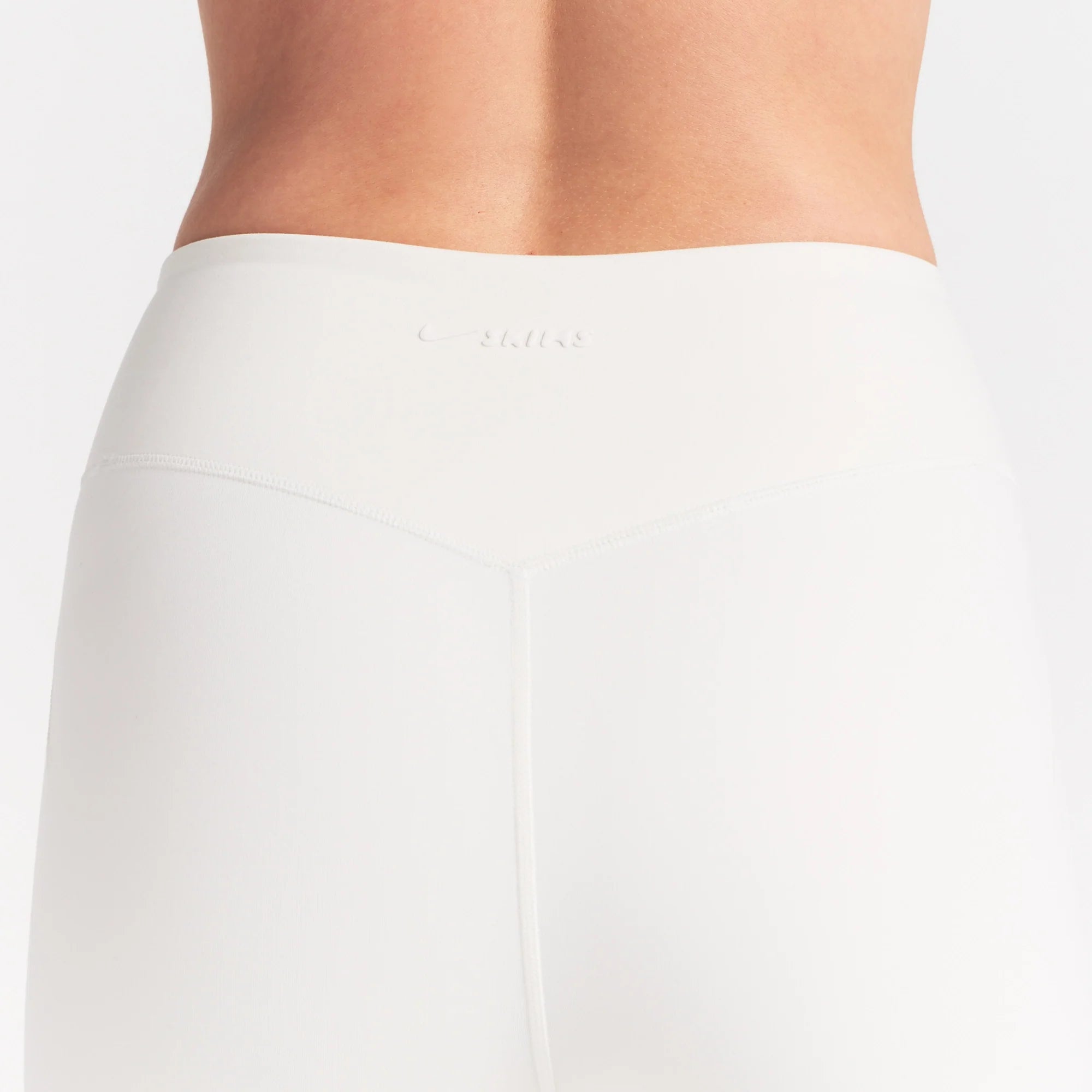 NikeSKIMS MATTE 26" LEGGING | IVORY ON A MODEL 