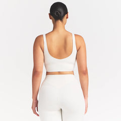 NikeSKIMS MATTE V-NECK BRA TOP | IVORY ON A MODEL 