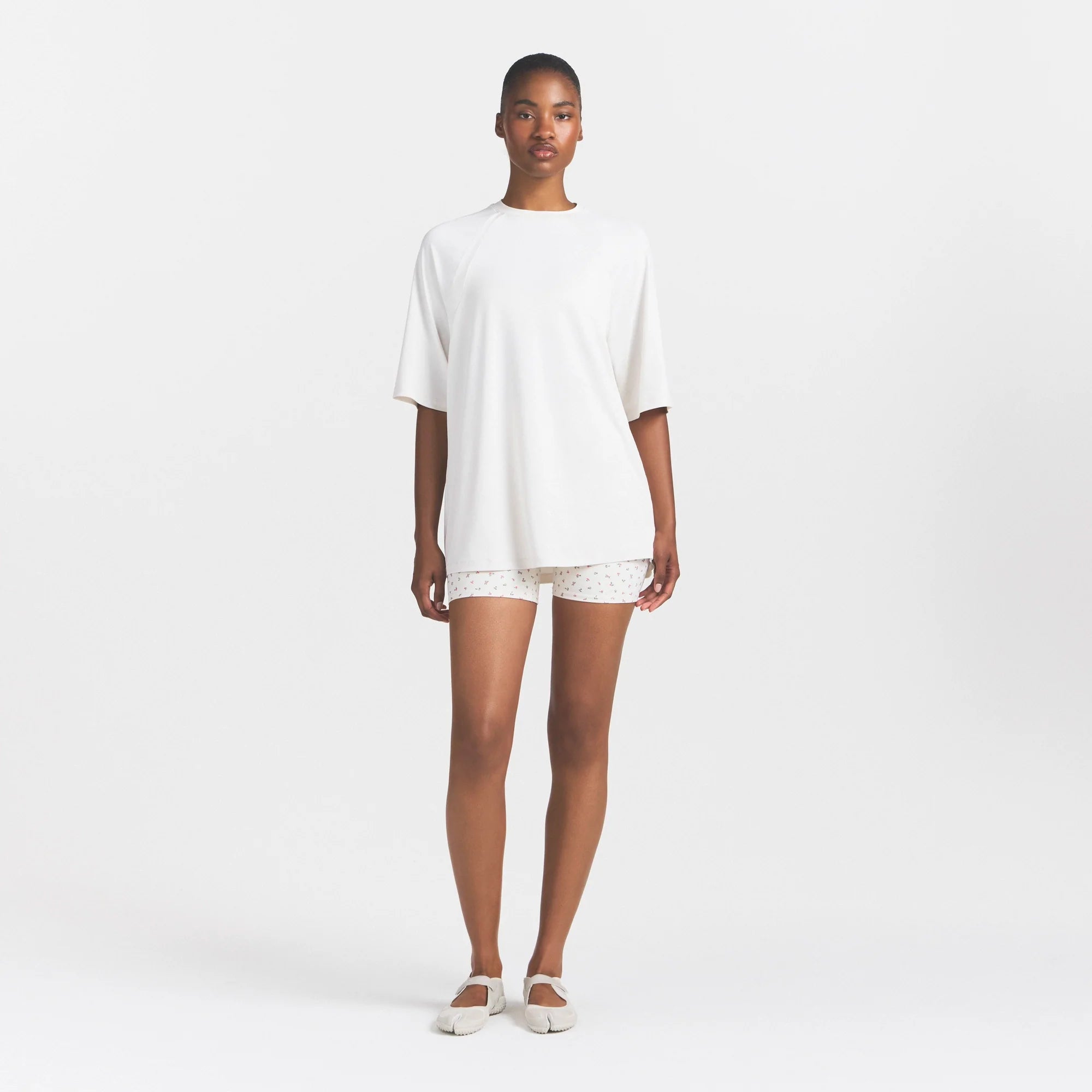 NikeSKIMS AIRY OVERSIZED TEE | IVORY ON A MODEL 