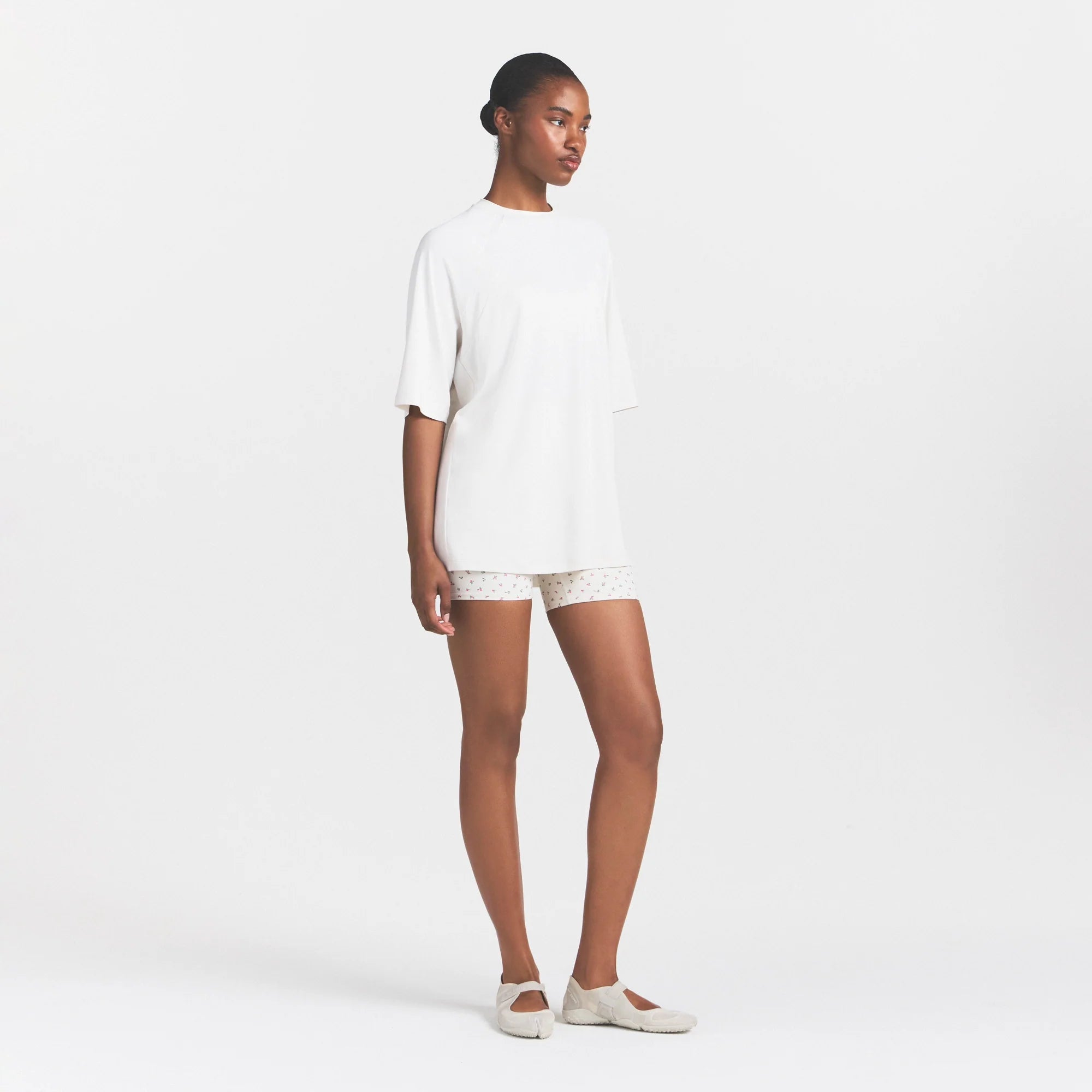 NikeSKIMS AIRY OVERSIZED TEE | IVORY ON A MODEL 
