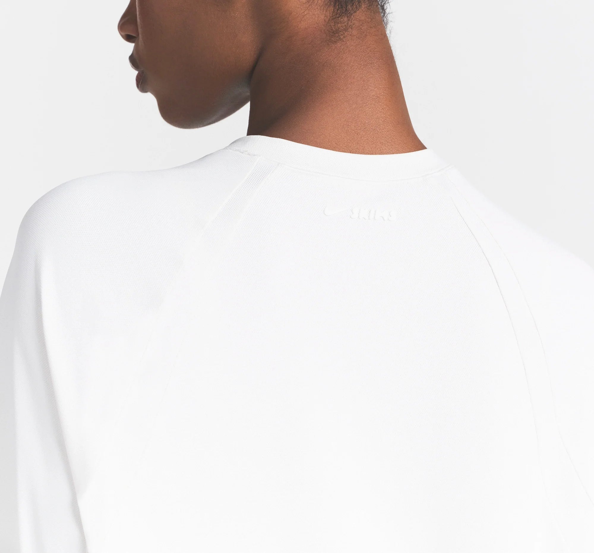 NikeSKIMS AIRY OVERSIZED TEE | IVORY ON A MODEL 