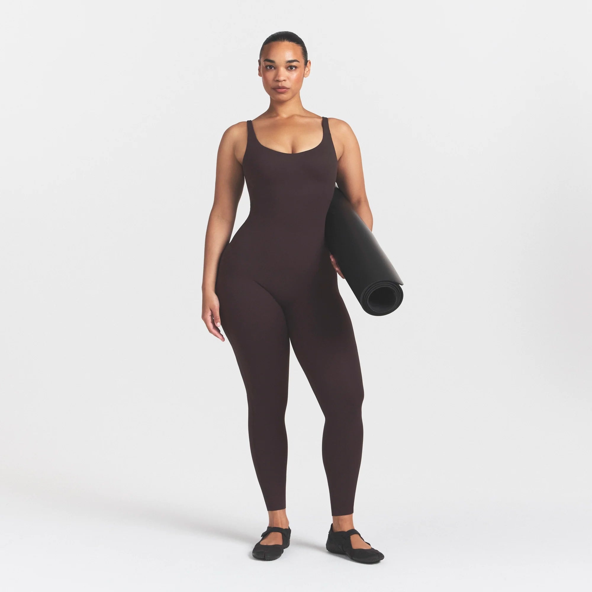 NikeSKIMS STUDIO STRETCH LONG 29" ONE PIECE | DARK ROASTON A MODEL FRONT 