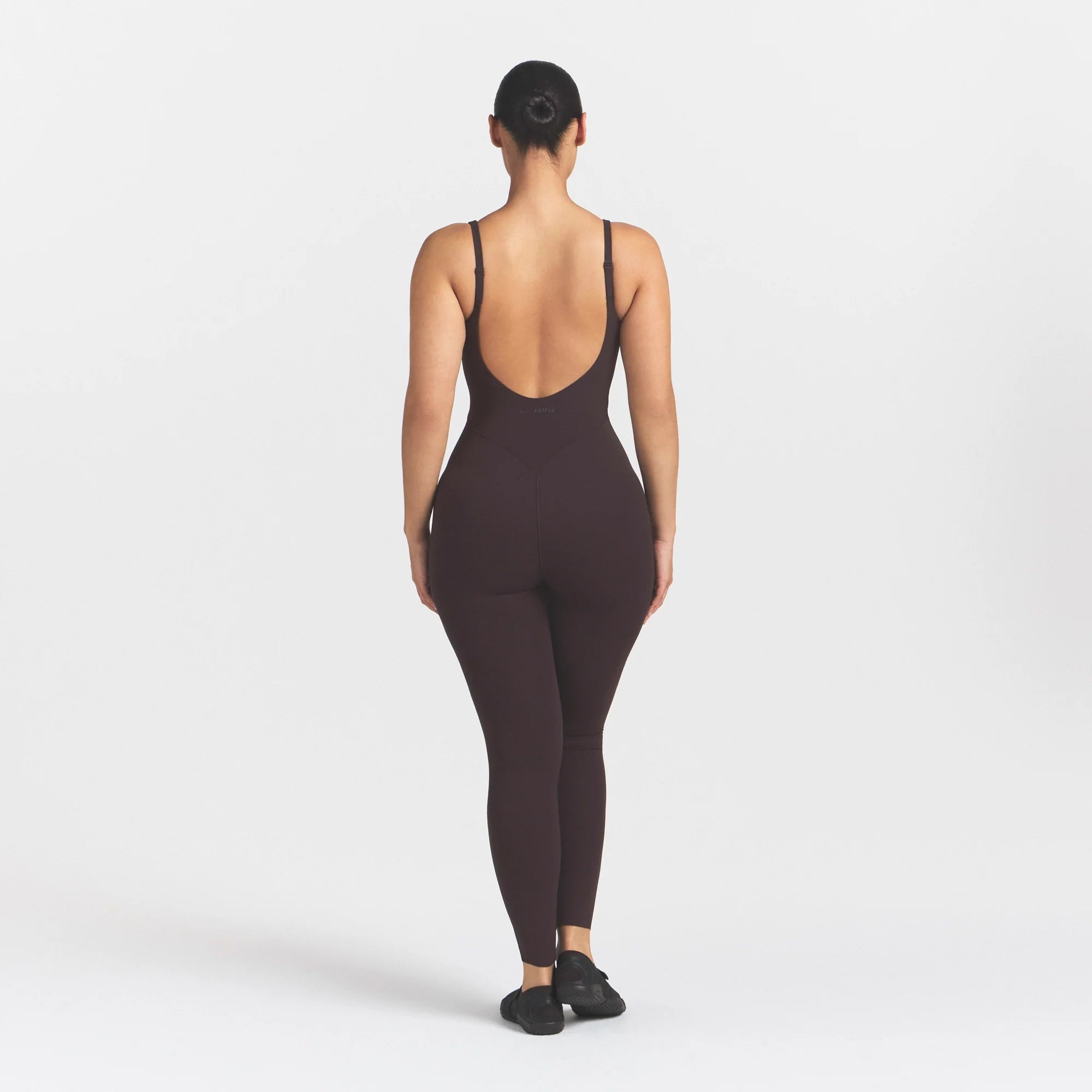 NikeSKIMS STUDIO STRETCH LONG 29" ONE PIECE | DARK ROASTON A MODEL FRONT 
