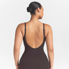 NikeSKIMS STUDIO STRETCH LONG 29" ONE PIECE | DARK ROASTON A MODEL FRONT 