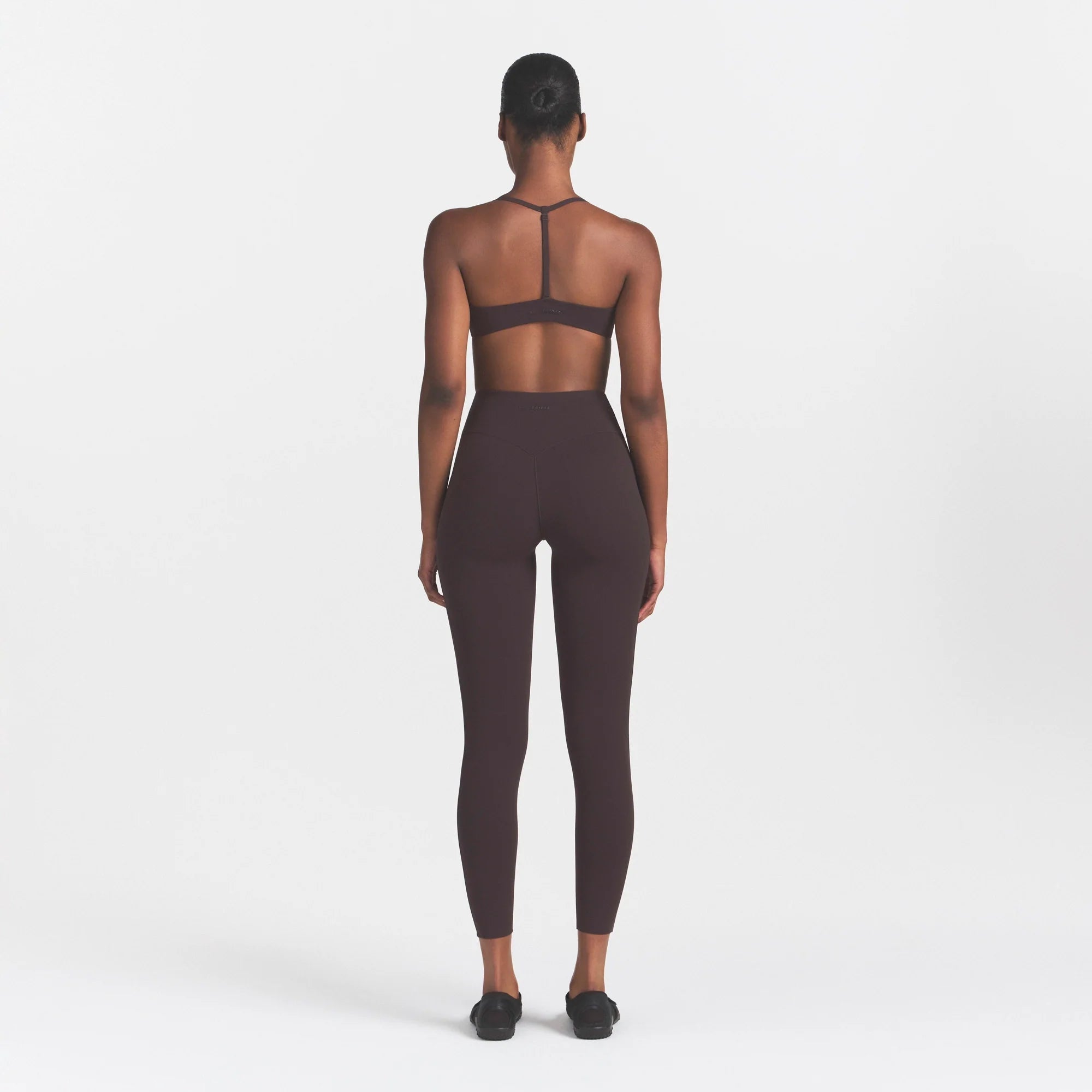 NikeSKIMS STUDIO STRETCH 26" LEGGING | DARK ROASTON A MODEL FRONT 