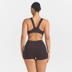 NikeSKIMS STUDIO STRETCH DIP FRONT 2" SHORT | DARK ROASTON A MODEL FRONT 