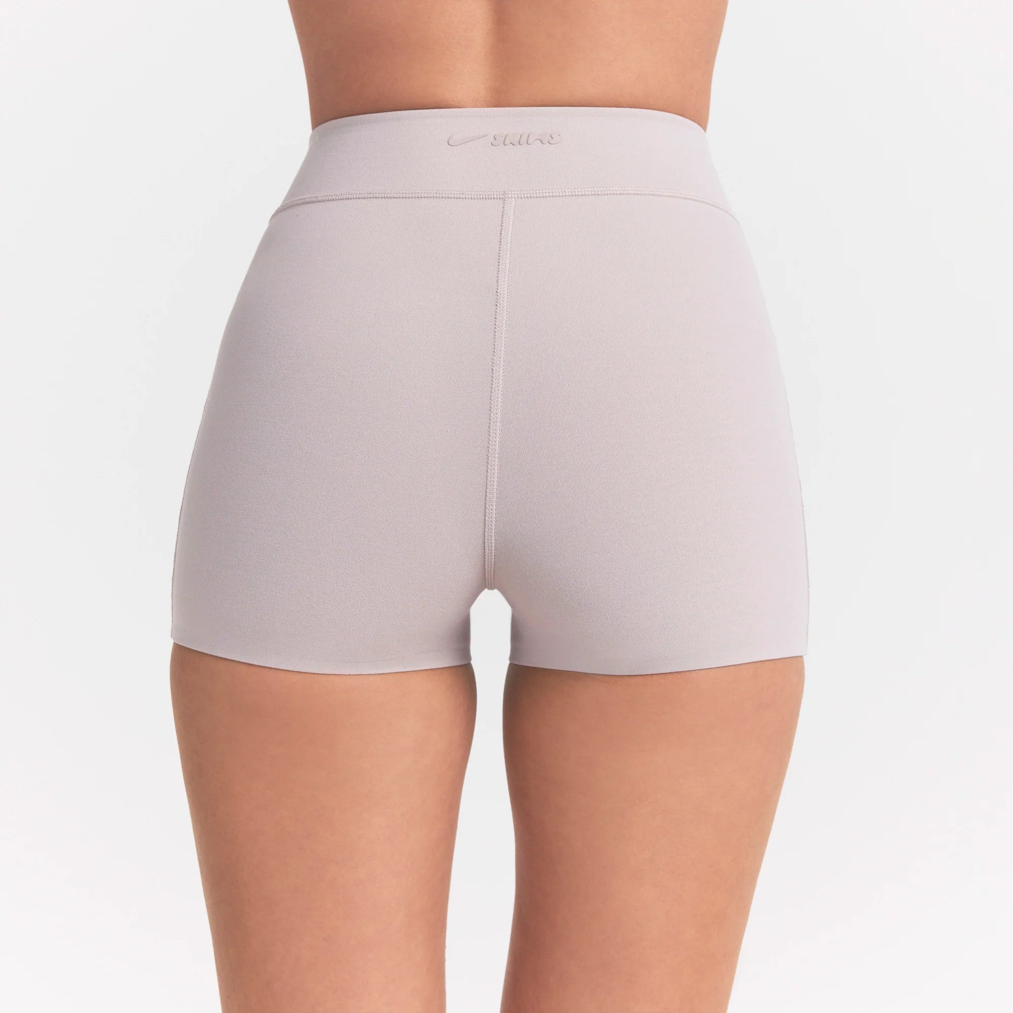NikeSKIMS STUDIO STRETCH DIP FRONT 2" SHORT | LINEN ON A MODEL FRONT 