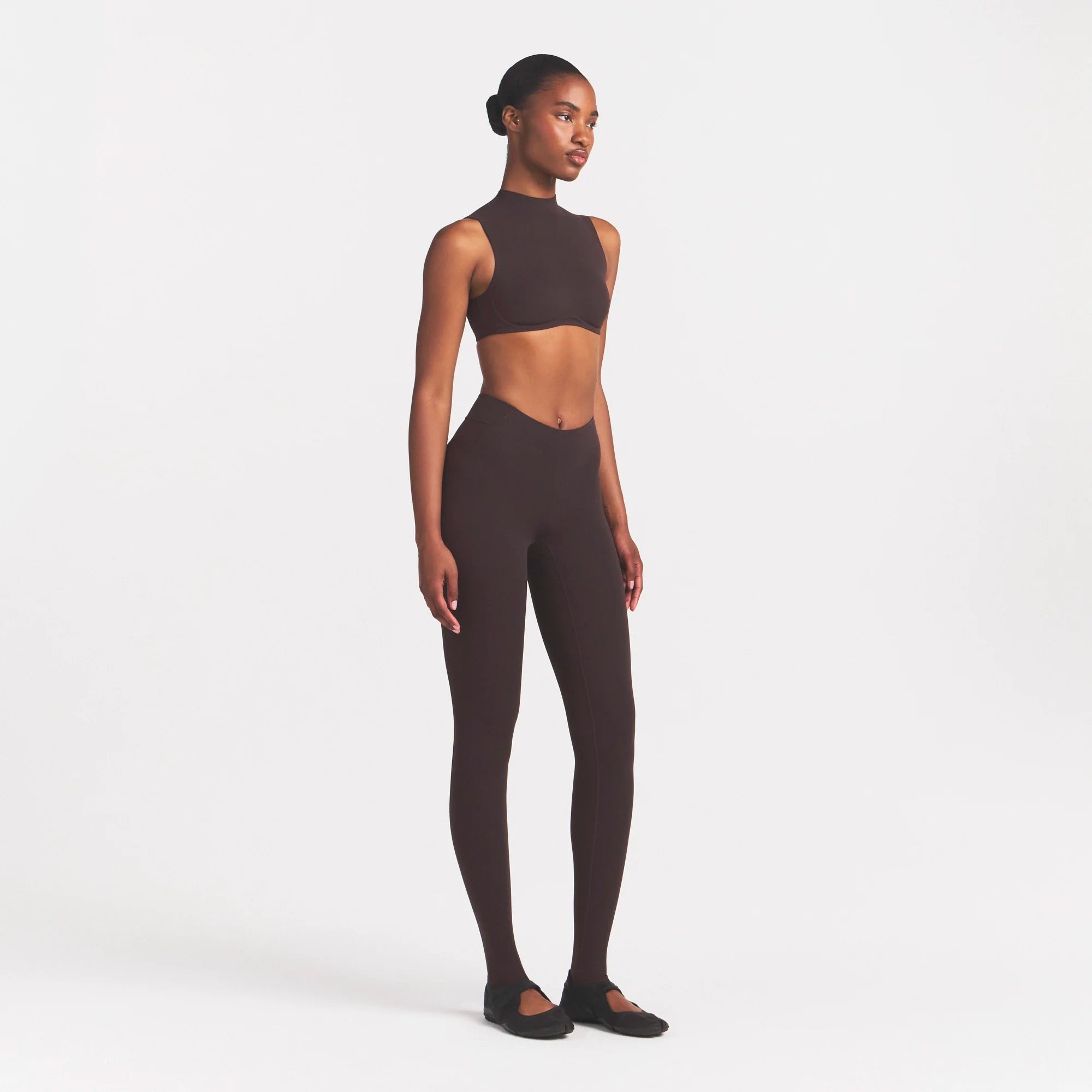 NikeSKIMS STUDIO STRETCH DIP FRONT 29" LEGGING | DARK ROASTON A MODEL FRONT 