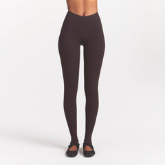 NikeSKIMS STUDIO STRETCH DIP FRONT 29" LEGGING | DARK ROASTON A MODEL FRONT 