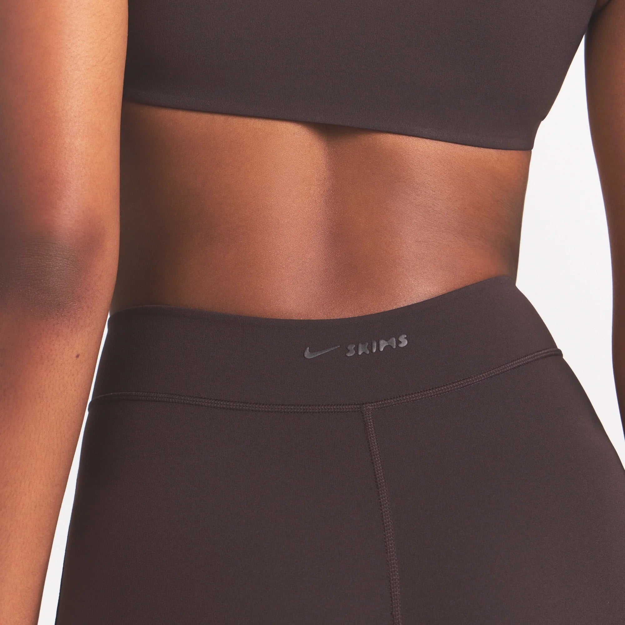 NikeSKIMS STUDIO STRETCH DIP FRONT 29" LEGGING | DARK ROASTON A MODEL FRONT 