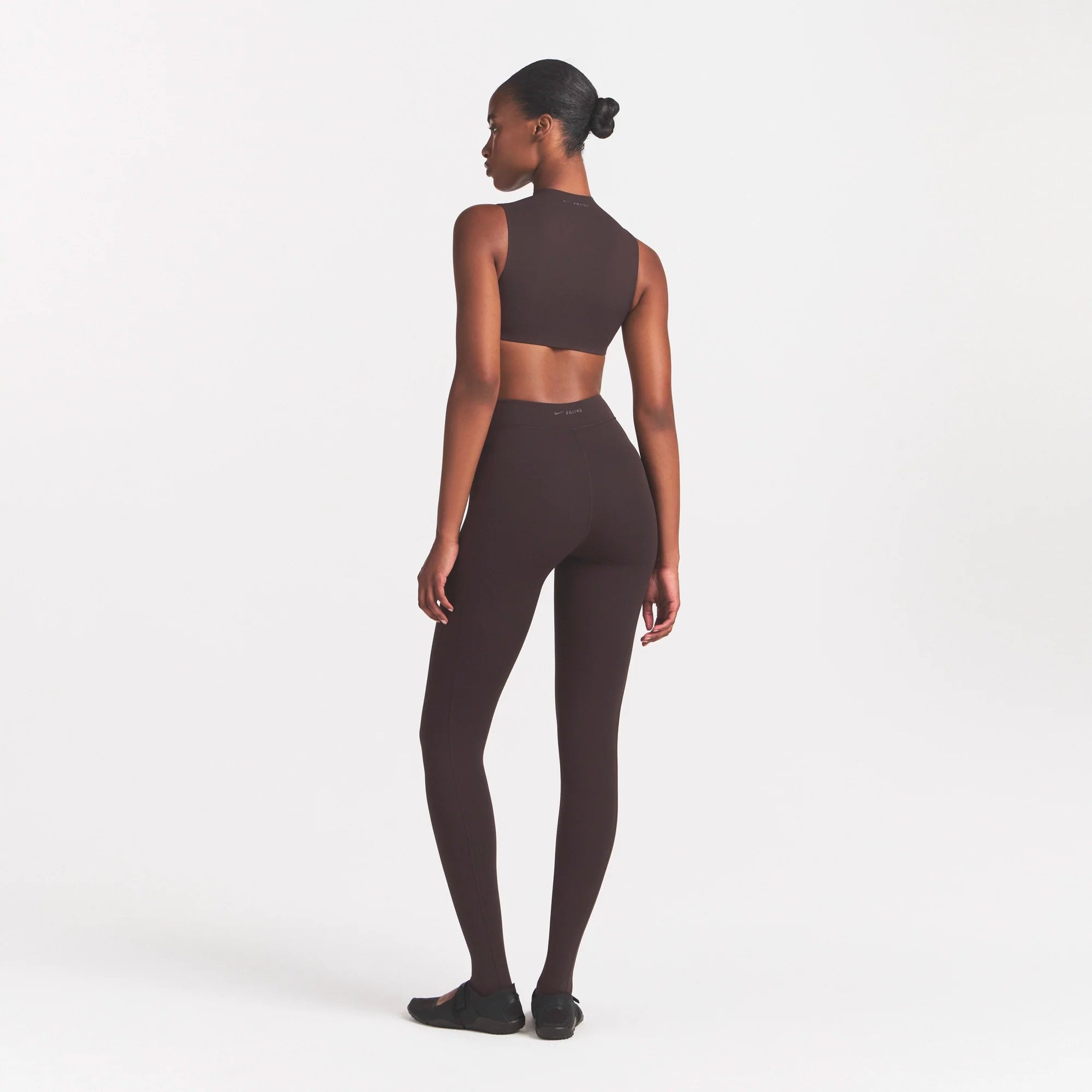 NikeSKIMS STUDIO STRETCH DIP FRONT 29" LEGGING | DARK ROASTON A MODEL FRONT 
