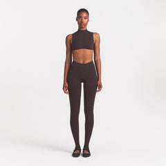 NikeSKIMS STUDIO STRETCH MOCK NECK BRA | DARK ROASTON A MODEL FRONT 