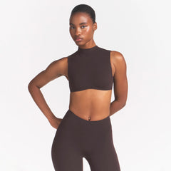 NikeSKIMS STUDIO STRETCH MOCK NECK BRA | DARK ROASTON A MODEL FRONT 