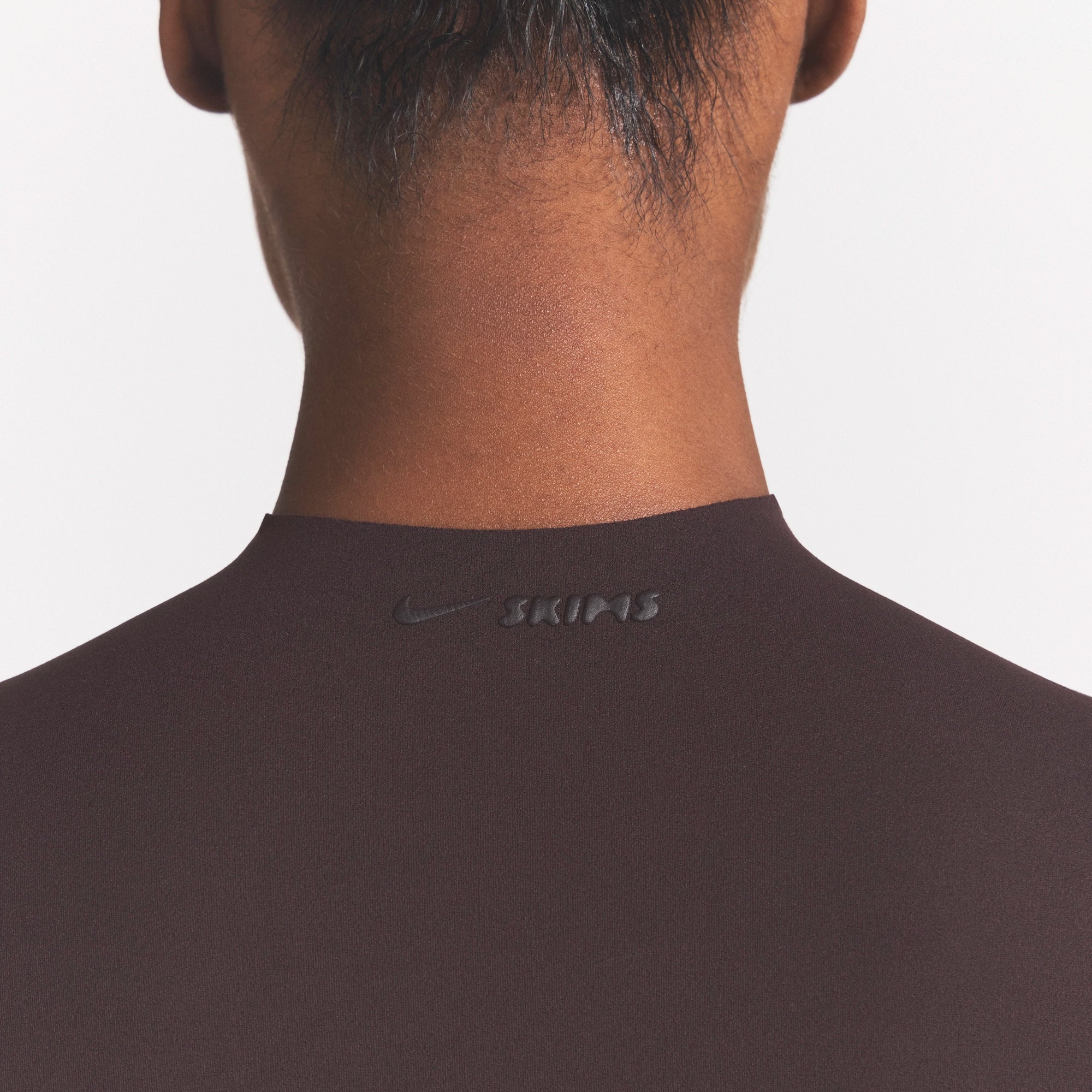 NikeSKIMS STUDIO STRETCH MOCK NECK BRA | DARK ROASTON A MODEL FRONT 