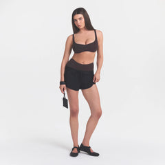 NikeSKIMS STUDIO STRETCH  SEAM FRONT MICRO BRA | DARK ROASTON A MODEL FRONT 