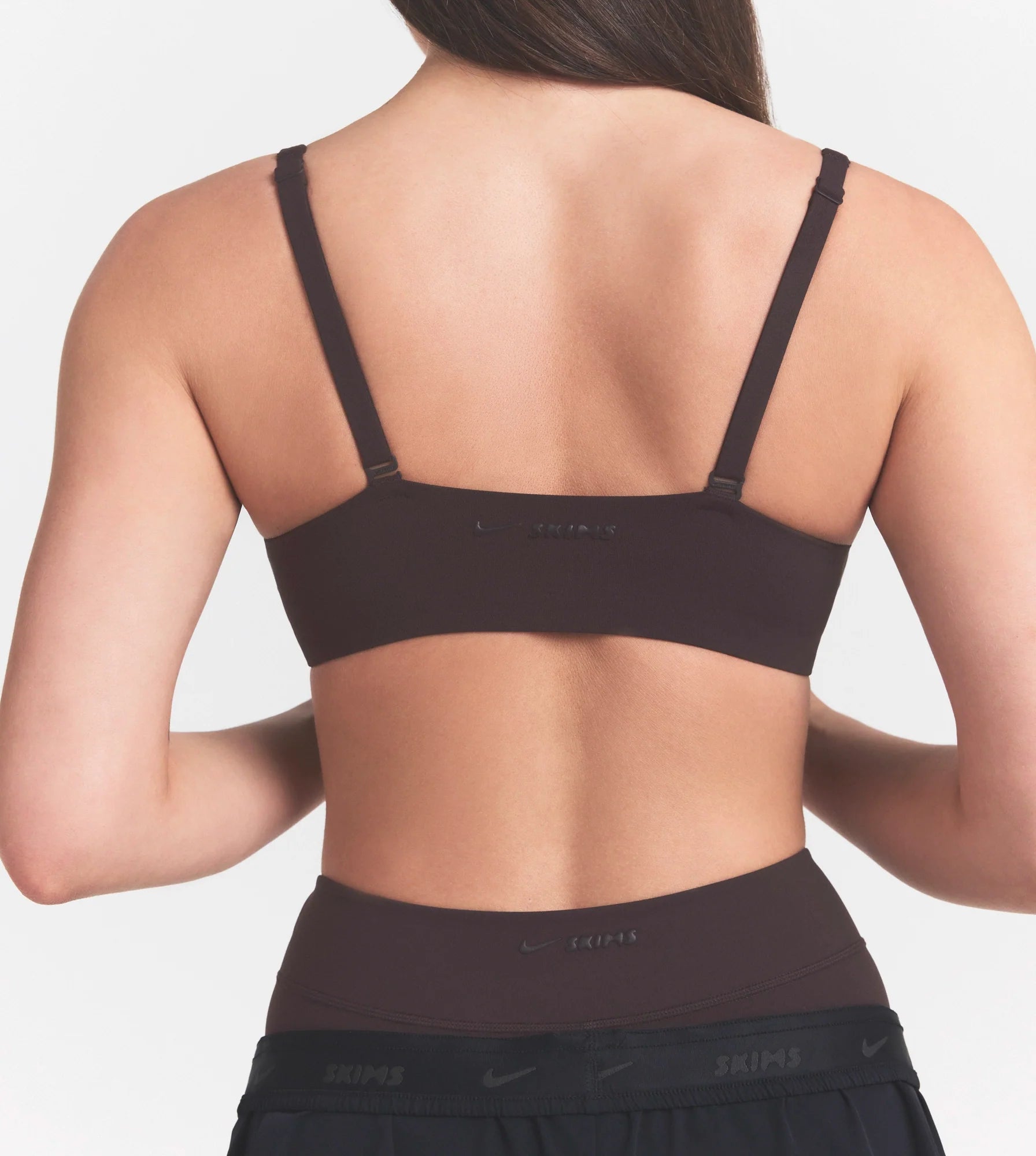 NikeSKIMS STUDIO STRETCH  SEAM FRONT MICRO BRA | DARK ROASTON A MODEL FRONT 