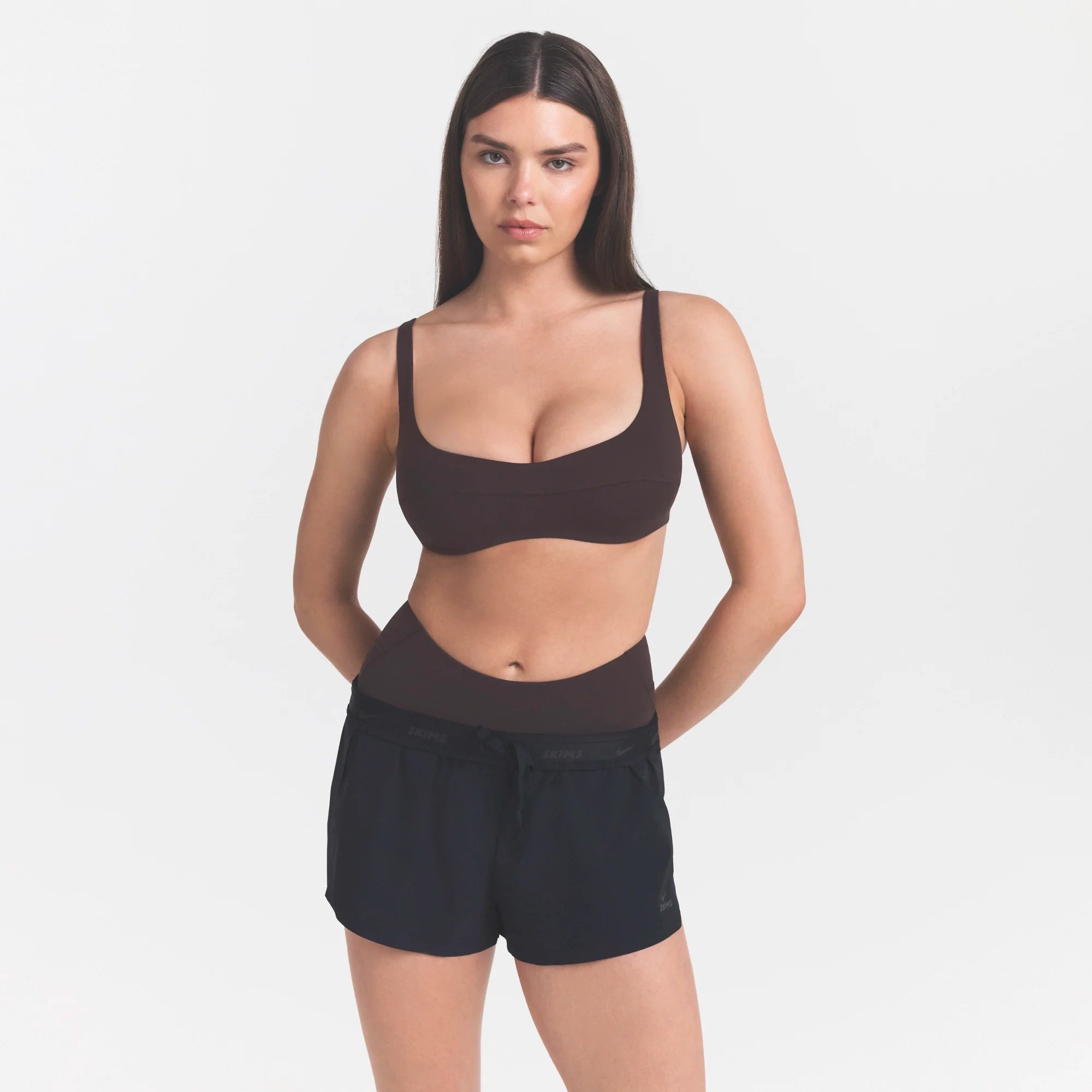 NikeSKIMS STUDIO STRETCH  SEAM FRONT MICRO BRA | DARK ROASTON A MODEL FRONT 