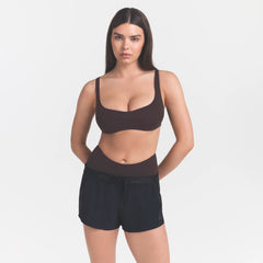 NikeSKIMS STUDIO STRETCH  SEAM FRONT MICRO BRA | DARK ROASTON A MODEL FRONT 