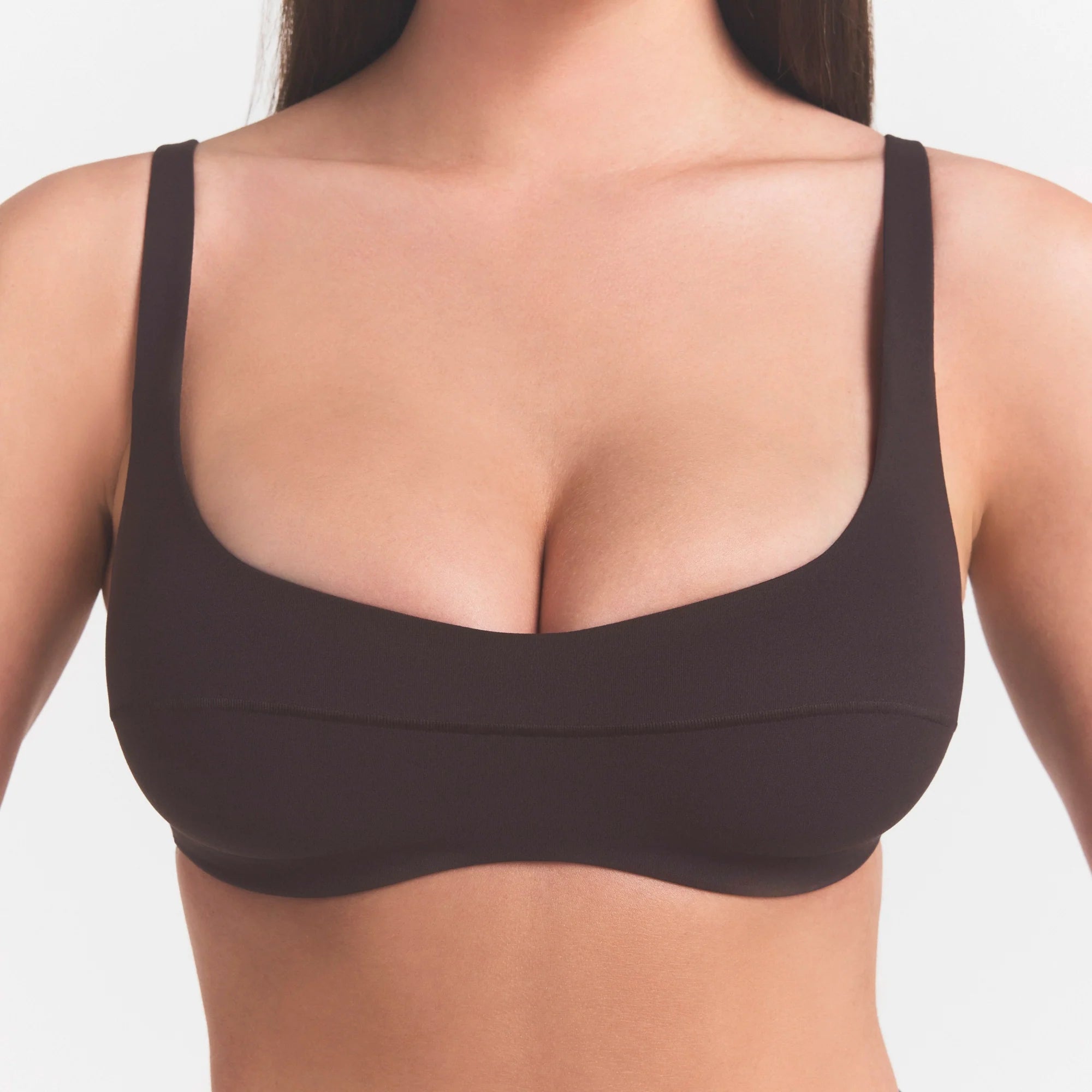 NikeSKIMS STUDIO STRETCH  SEAM FRONT MICRO BRA | DARK ROASTON A MODEL FRONT 