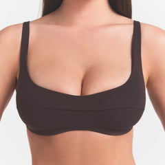 NikeSKIMS STUDIO STRETCH  SEAM FRONT MICRO BRA | DARK ROASTON A MODEL FRONT 