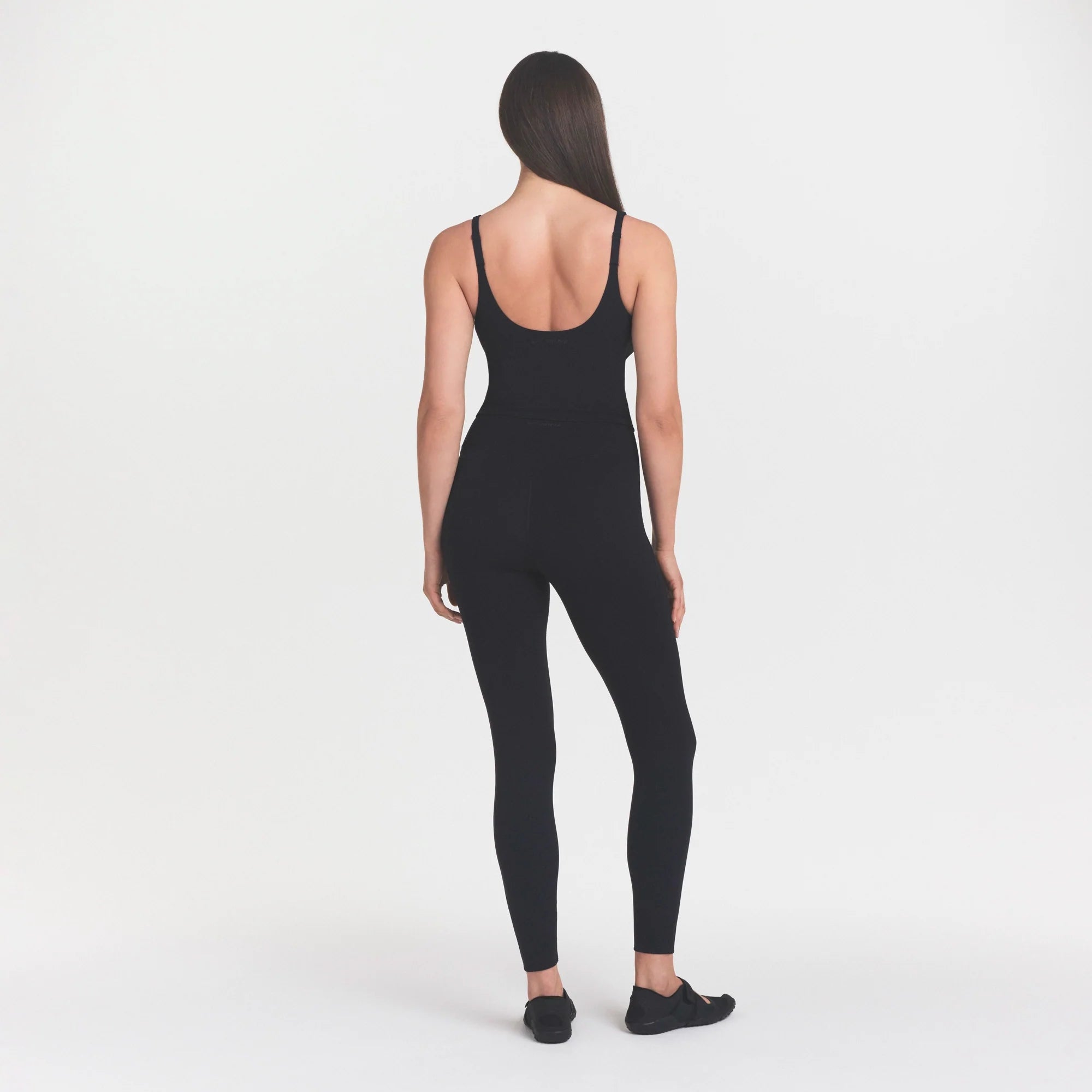 NikeSKIMS STUDIO STRETCH PLUNGE TANK | OBSIDIANON A MODEL FRONT 