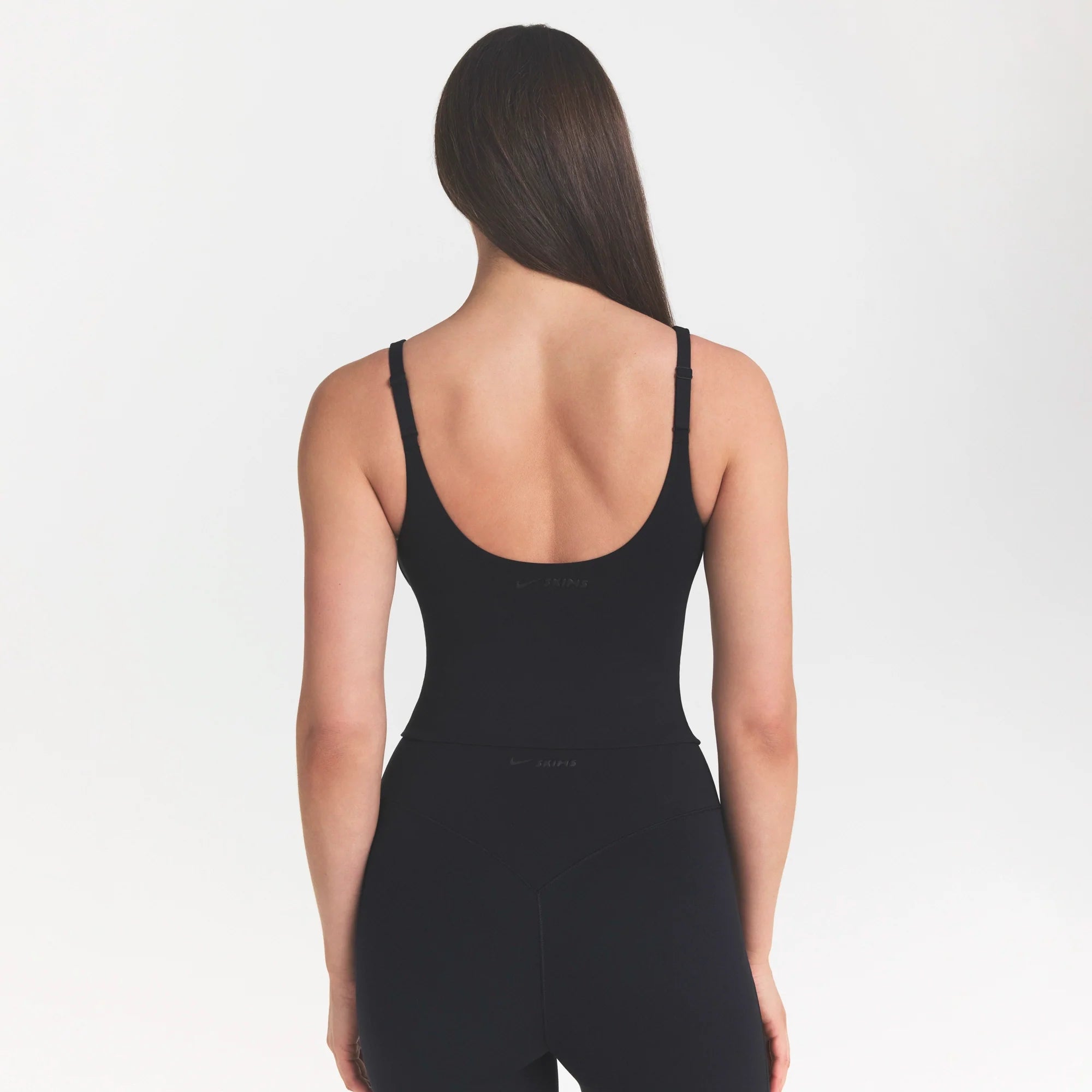 NikeSKIMS STUDIO STRETCH PLUNGE TANK | OBSIDIANON A MODEL FRONT 