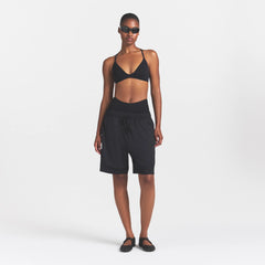 NikeSKIMS AIRY RELAXED SHORT | NSKM OBSIDIAN ON A MODEL 