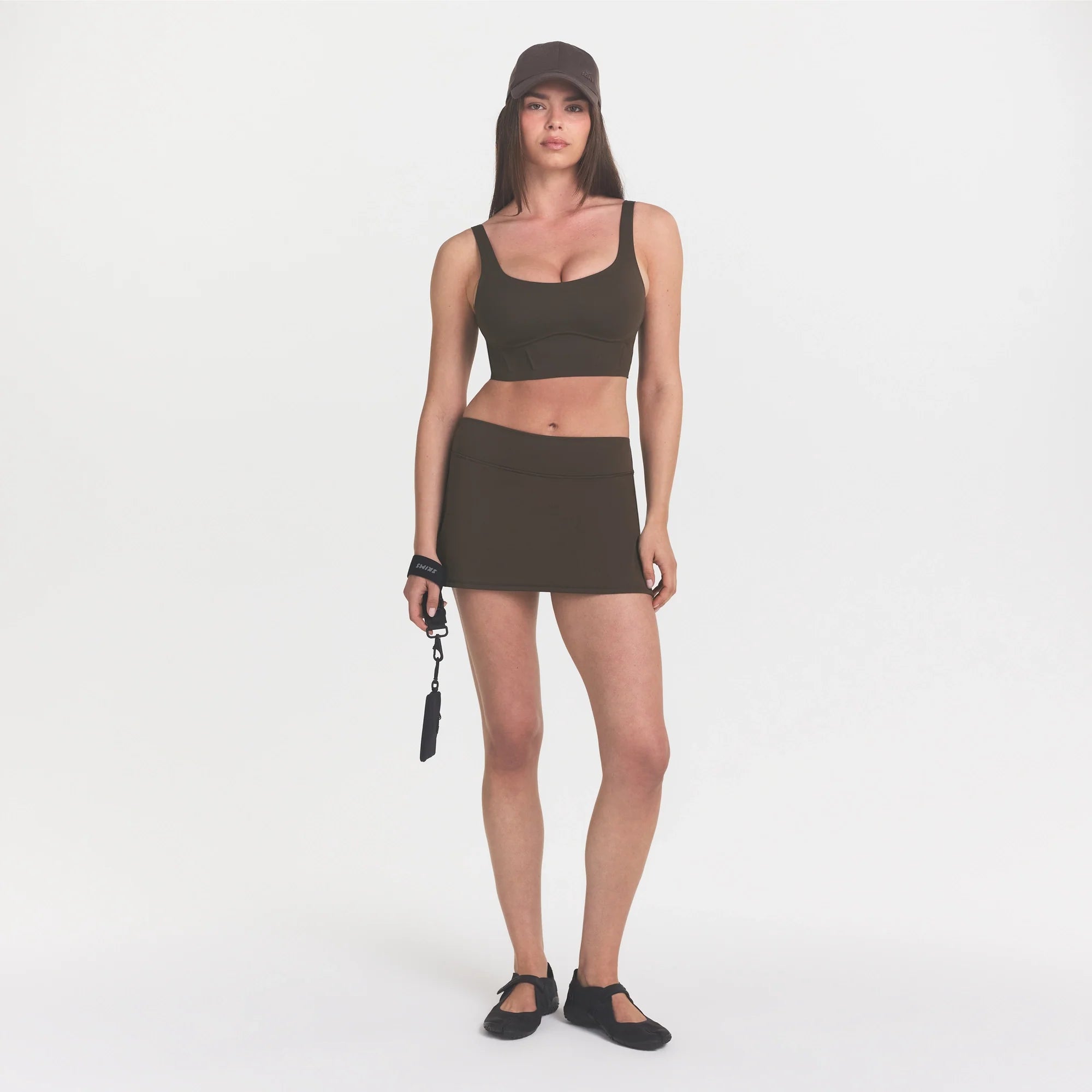 NikeSKIMS MATTE CORSET LONGLINE BRA | DARK SEPIA ON A MODEL 
