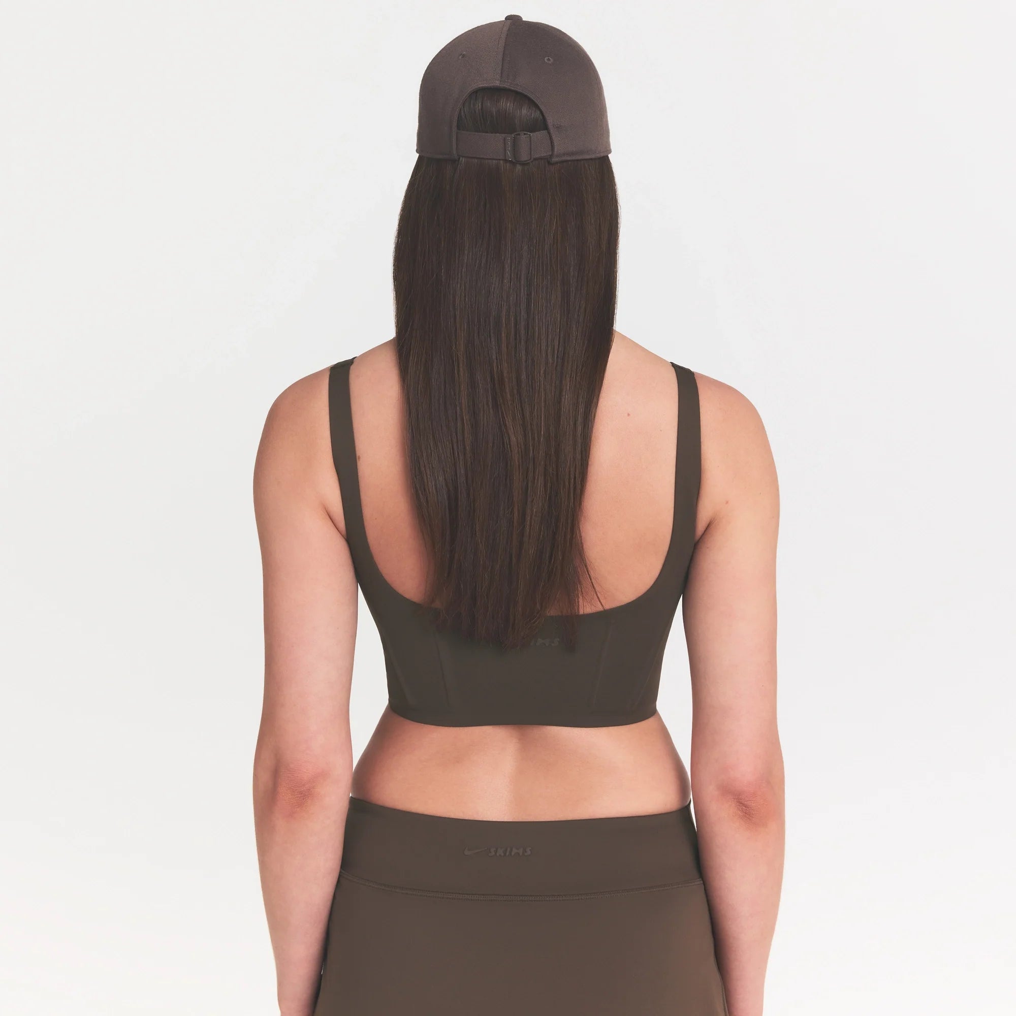 NikeSKIMS MATTE CORSET LONGLINE BRA | DARK SEPIA ON A MODEL 