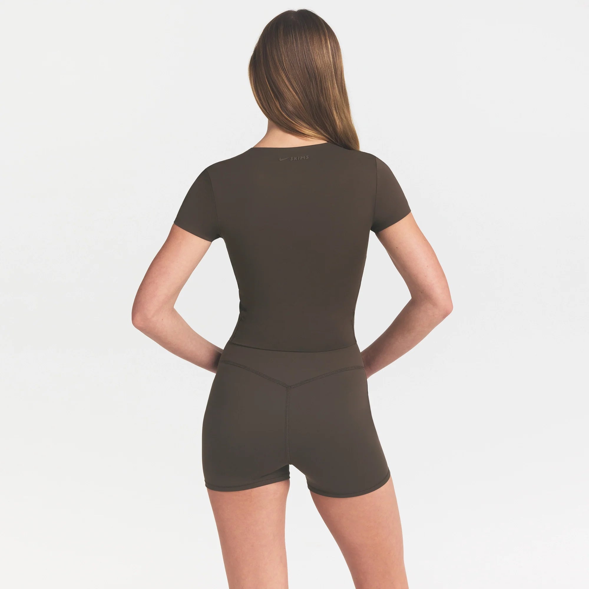 NikeSKIMS MATTE CORSET CROP TOP | DARK SEPIA ON A MODEL 