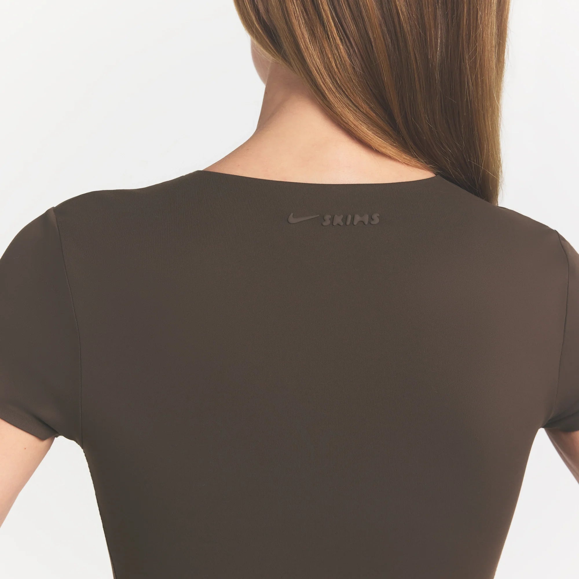 NikeSKIMS MATTE CORSET CROP TOP | DARK SEPIA ON A MODEL 
