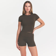 NikeSKIMS MATTE CORSET CROP TOP | DARK SEPIA ON A MODEL 