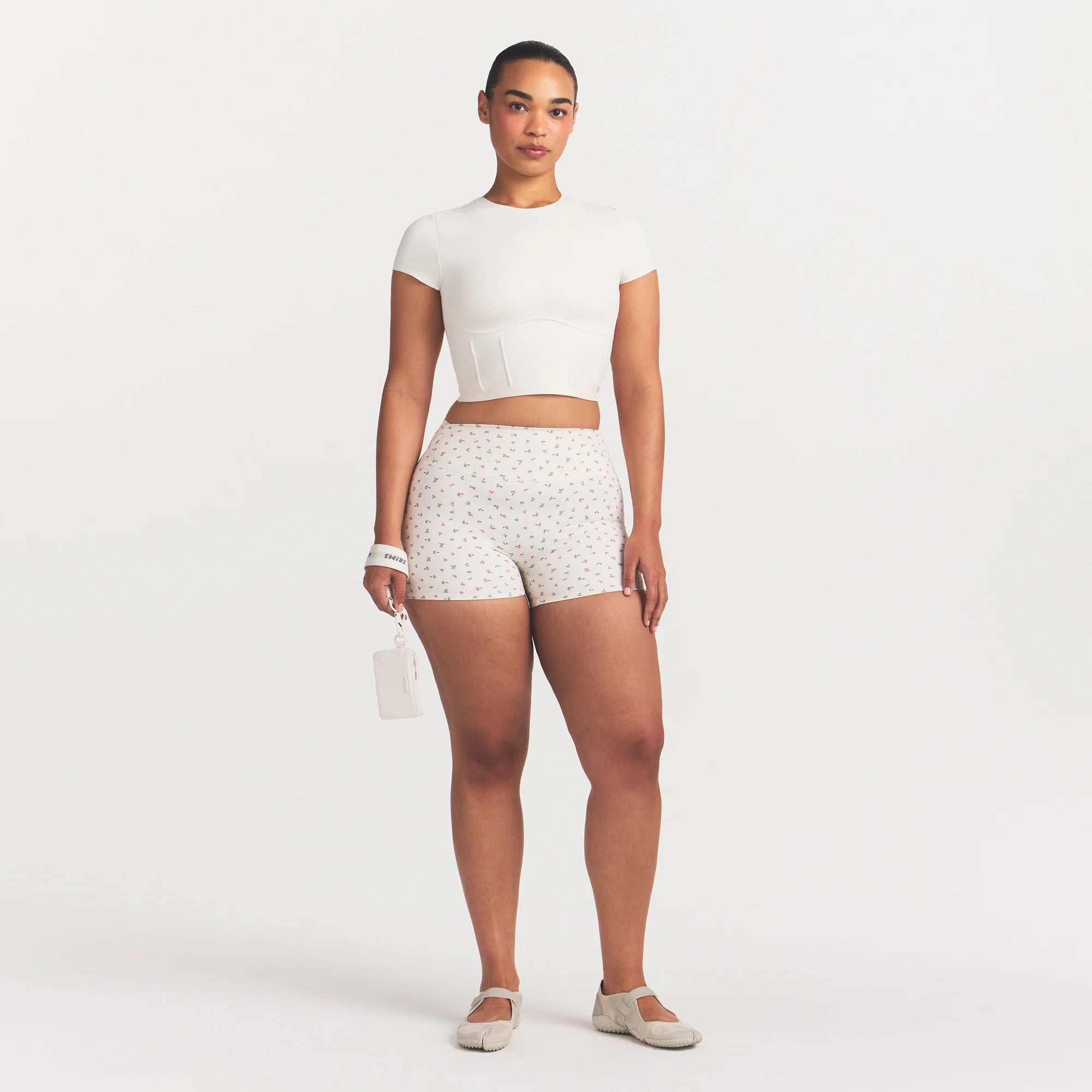 NikeSKIMS MATTE CORSET CROP TOP | IVORY ON A MODEL 
